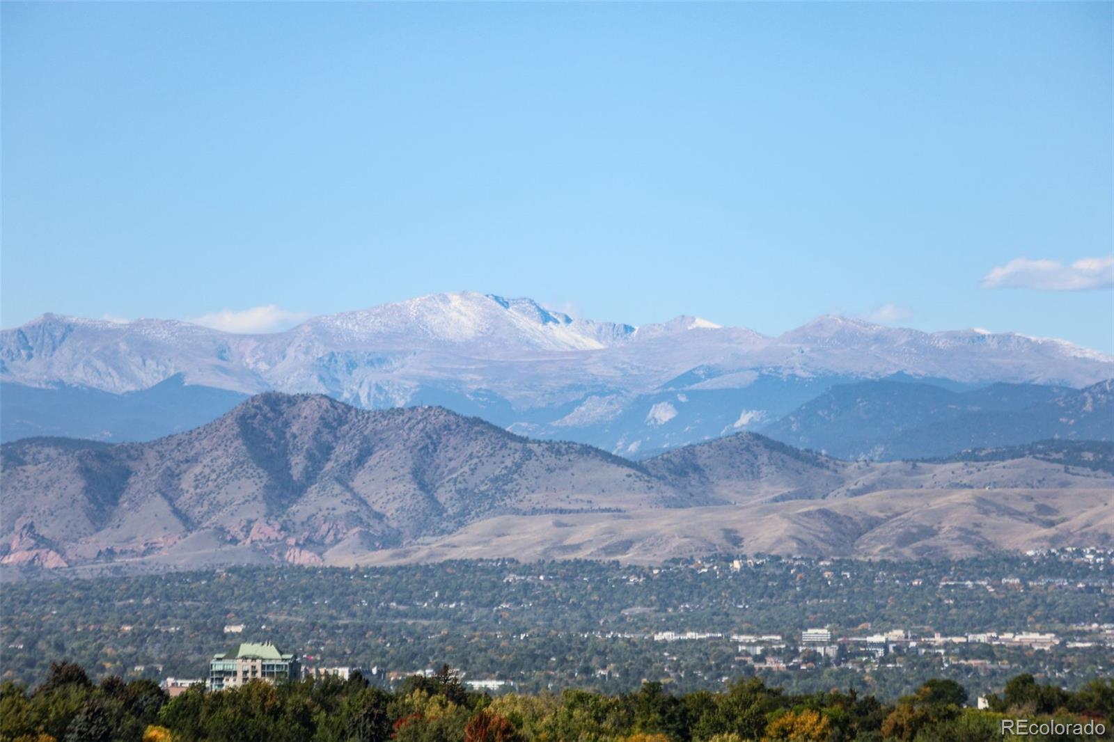955 Eudora Street, Unit 1601 Denver, CO 80220 - Photo 26 of 36 a view of a dry yard with mountains in the background