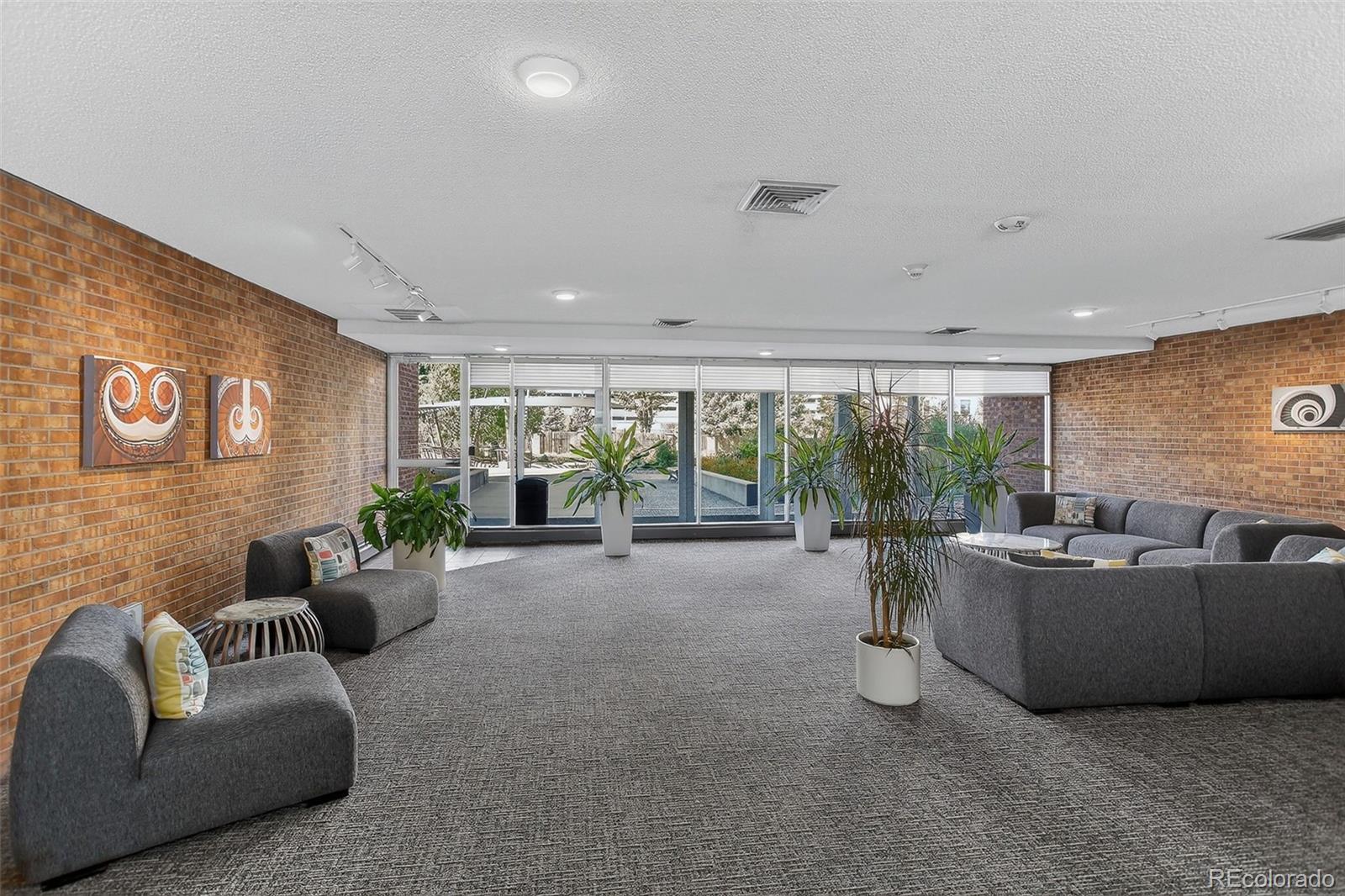955 Eudora Street, Unit 1601 Denver, CO 80220 - Photo 34 of 36 a living room with furniture and a large window