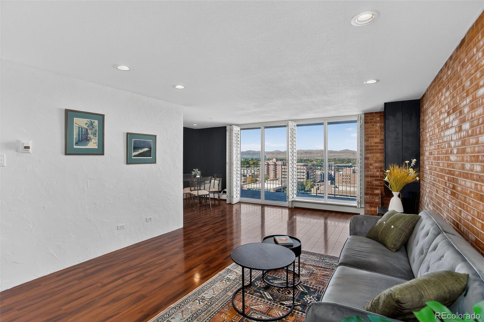 955 Eudora Street, Unit 1601 Denver, CO 80220 - Photo 5 of 36 a living room with furniture and a large window