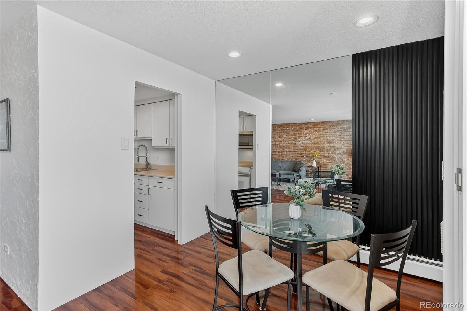 955 Eudora Street, Unit 1601 Denver, CO 80220 - Photo 8 of 36 a view of a dining room with furniture window and wooden floor