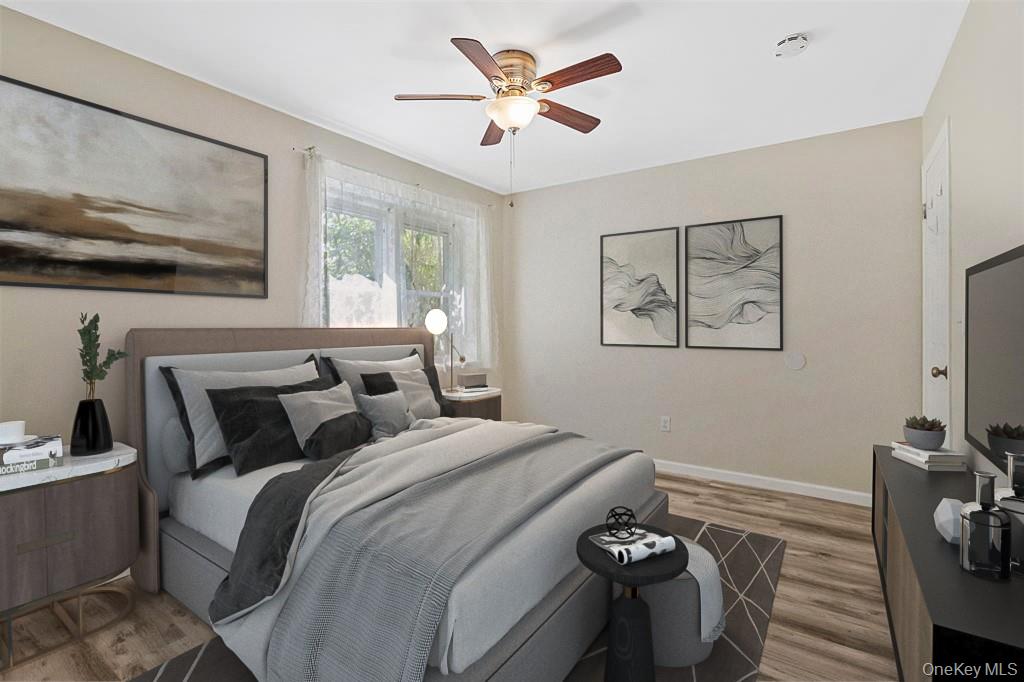 68 Gerald Drive, Unit D1 Poughkeepsie, NY 12601 - Photo 14 of 29 Bedroom with wood finished floors and ceiling fan