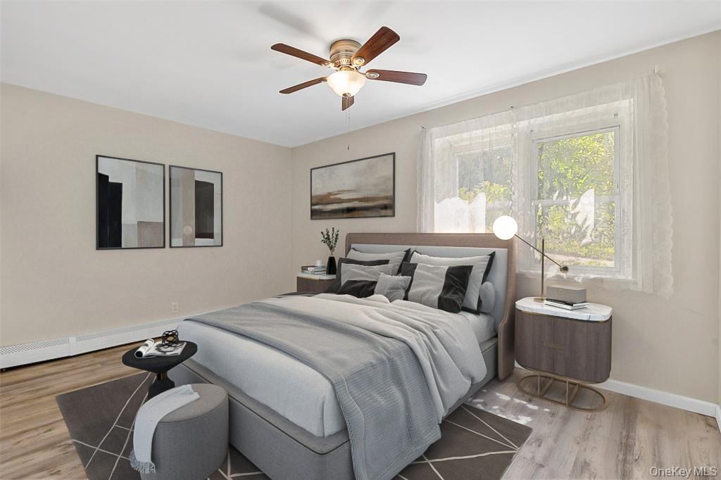 68 Gerald Drive, Unit D1 Poughkeepsie, NY 12601 - Photo 15 of 29 Bedroom featuring light wood-style flooring and ceiling fan