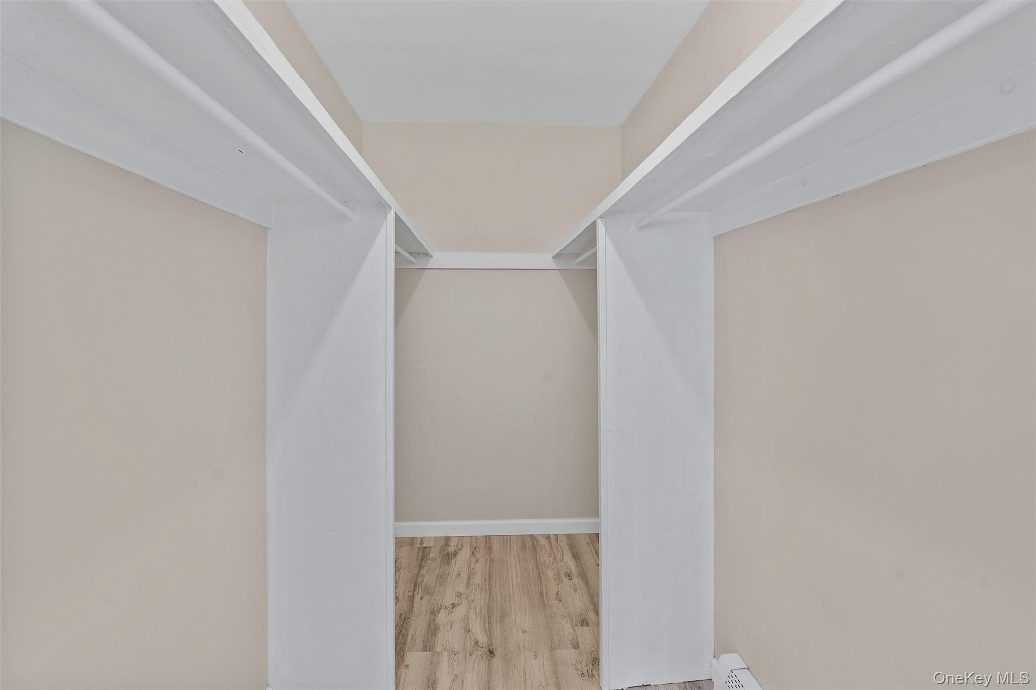 68 Gerald Drive, Unit D1 Poughkeepsie, NY 12601 - Photo 19 of 29 Walk in closet featuring wood finished floors