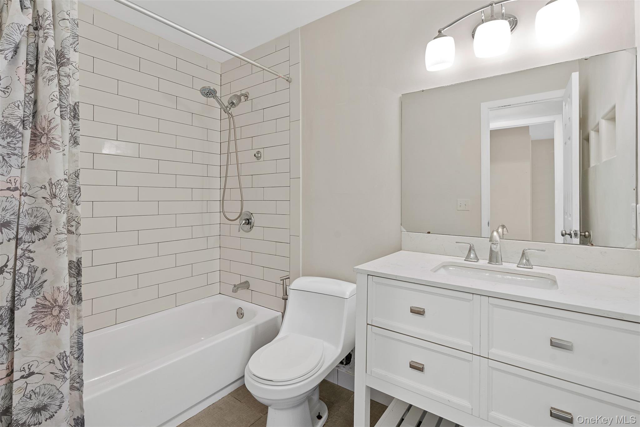 68 Gerald Drive, Unit D1 Poughkeepsie, NY 12601 - Photo 20 of 29 Bathroom featuring shower / bath combination with curtain and vanity