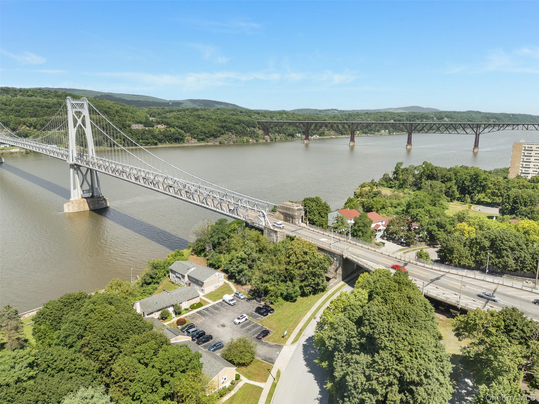 68 Gerald Drive, Unit D1 Poughkeepsie, NY 12601 - Photo 22 of 29 Aerial view of a notable bridge and a large body of water