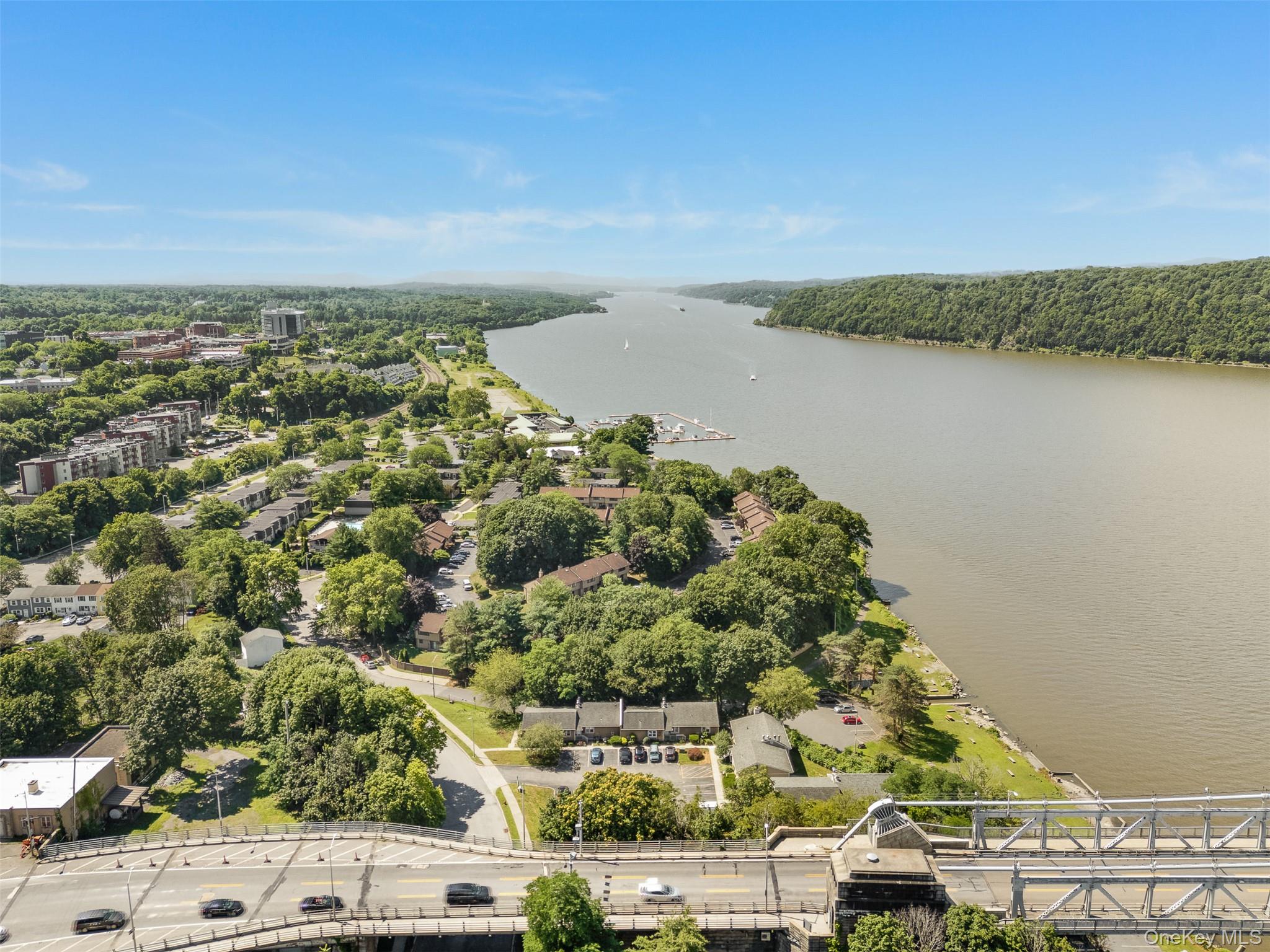 68 Gerald Drive, Unit D1 Poughkeepsie, NY 12601 - Photo 24 of 29 Drone / aerial view of a large body of water and a heavily wooded area