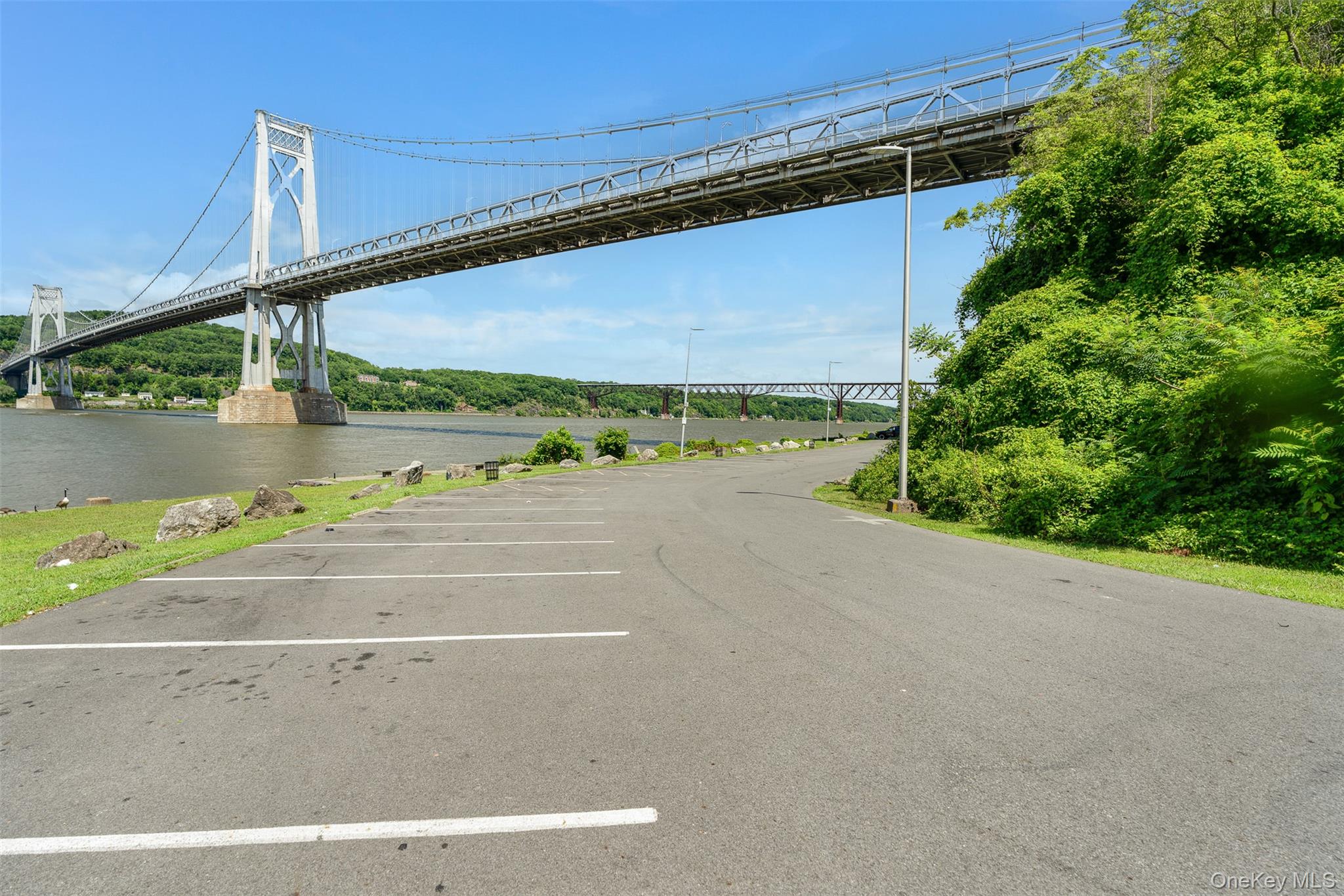 68 Gerald Drive, Unit D1 Poughkeepsie, NY 12601 - Photo 27 of 29 Uncovered parking lot with a water view