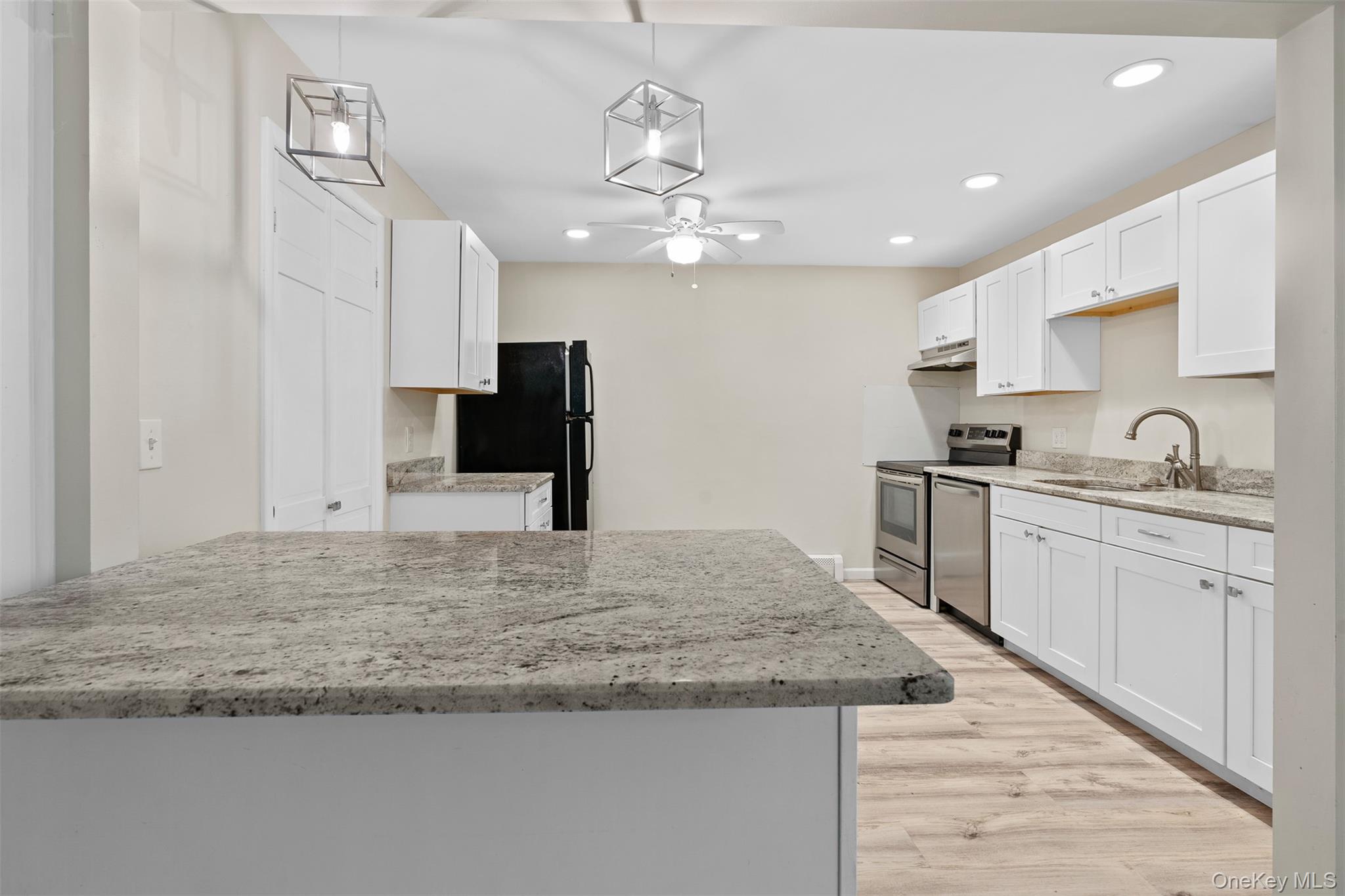 68 Gerald Drive, Unit D1 Poughkeepsie, NY 12601 - Photo 10 of 29 Kitchen with freestanding refrigerator, electric range, dishwasher, white cabinetry, and recessed lighting