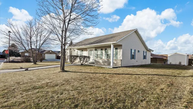 a view of a house with a yard