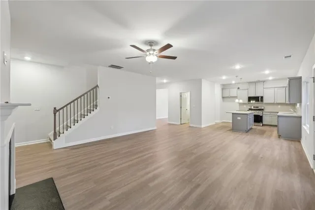 a view of kitchen with wooden floor and a kitchen view