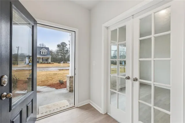 a view of a glass door and a window
