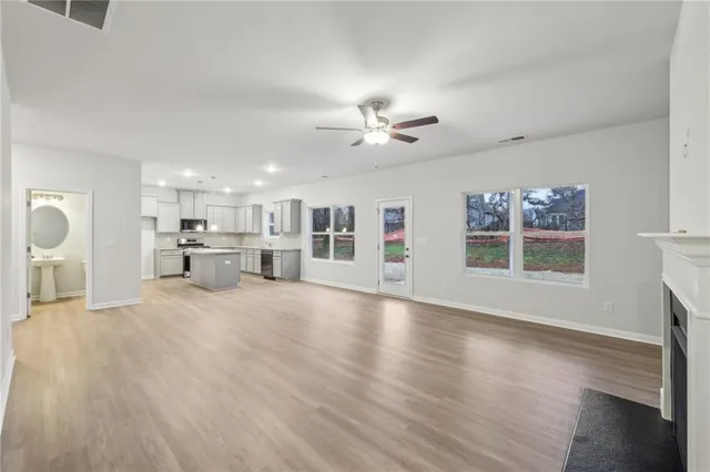 a view of a kitchen with a sink and a window