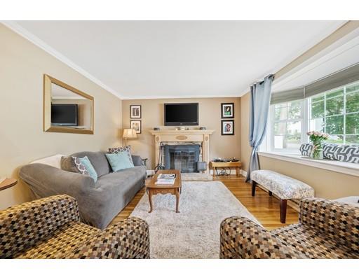31 Merilyn Road Weymouth, MA 02190 - Photo 11 of 25 a living room with furniture a fireplace and a flat screen tv