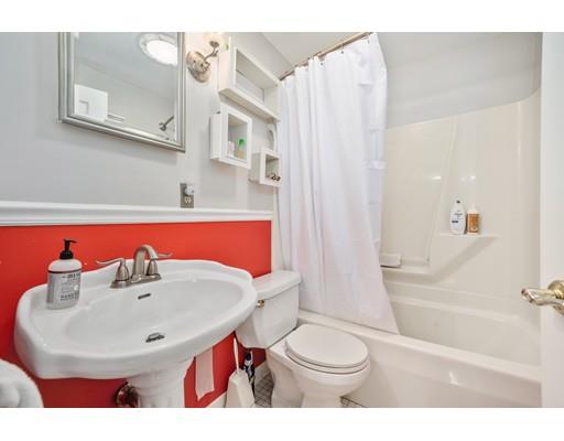 31 Merilyn Road Weymouth, MA 02190 - Photo 16 of 25 a bathroom with a sink a toilet and shower