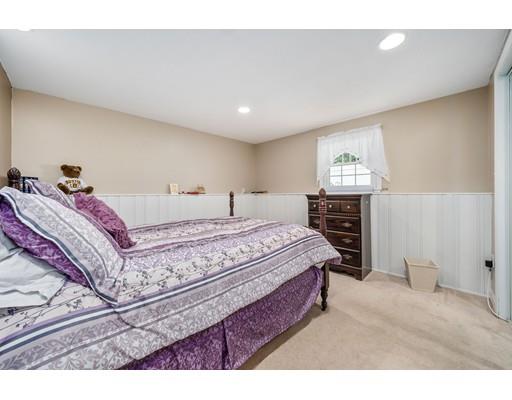 31 Merilyn Road Weymouth, MA 02190 - Photo 18 of 25 a bedroom with a bed and a night stand