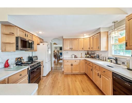 31 Merilyn Road Weymouth, MA 02190 - Photo 6 of 25 a kitchen with stainless steel appliances granite countertop a stove a sink dishwasher and a refrigerator