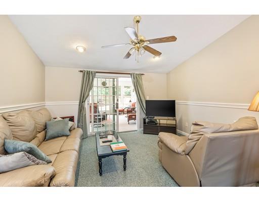 31 Merilyn Road Weymouth, MA 02190 - Photo 8 of 25 a living room with furniture and a flat screen tv