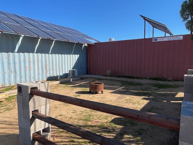 20810 South Cheyenne Road Yucca, AZ 86438 - Photo 19 of 26 a view of a backyard with a chair and wooden floor