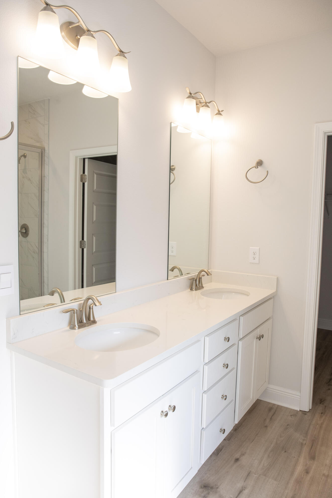 56 Secluded Circle Freeport, FL 32439 - Photo 14 of 26 a bathroom with a sink vanity and a mirror