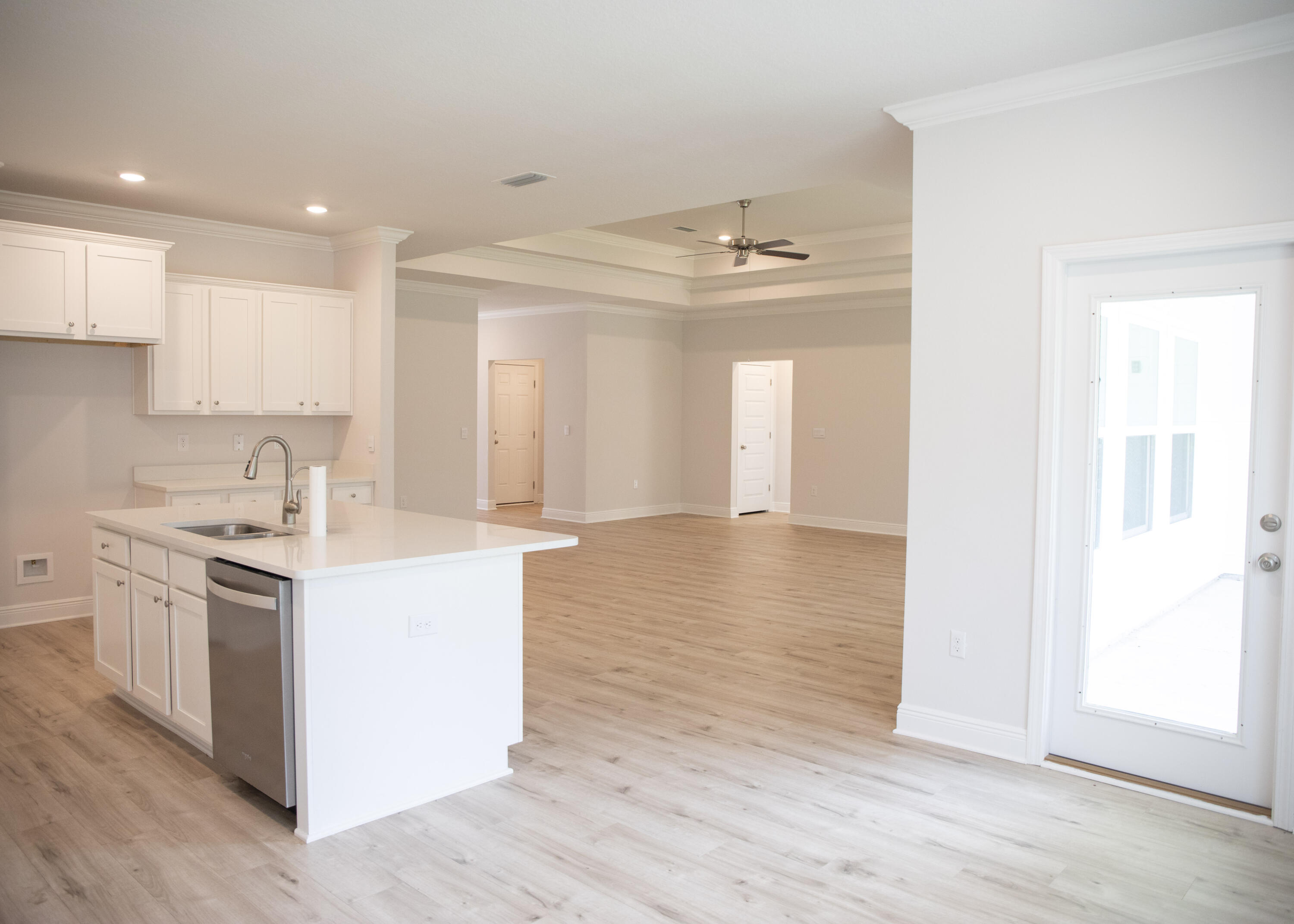 56 Secluded Circle Freeport, FL 32439 - Photo 17 of 26 a kitchen with a sink cabinets stainless steel appliances and a window