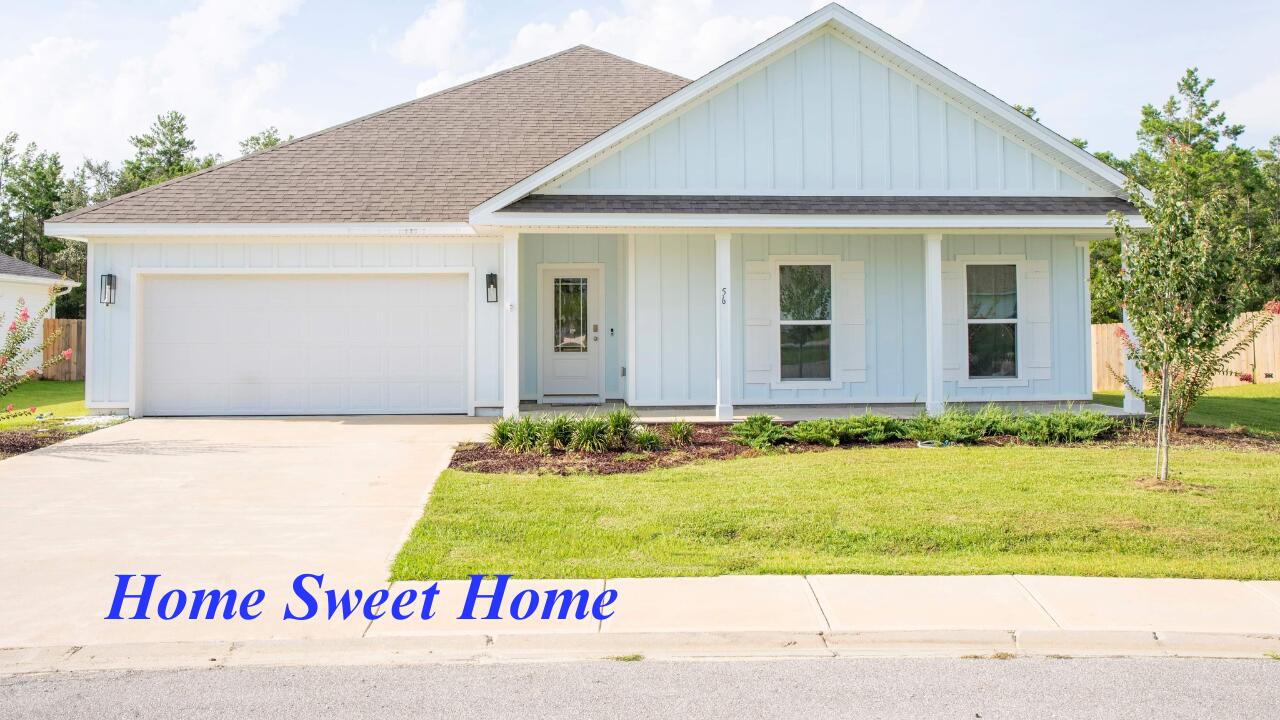 56 Secluded Circle Freeport, FL 32439 - Photo 2 of 26 a sign that is on the side of a white house