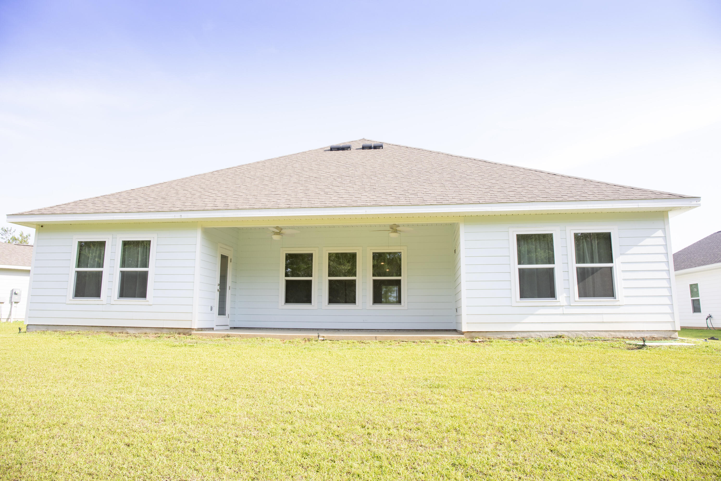 56 Secluded Circle Freeport, FL 32439 - Photo 23 of 26 a view of a house with a backyard