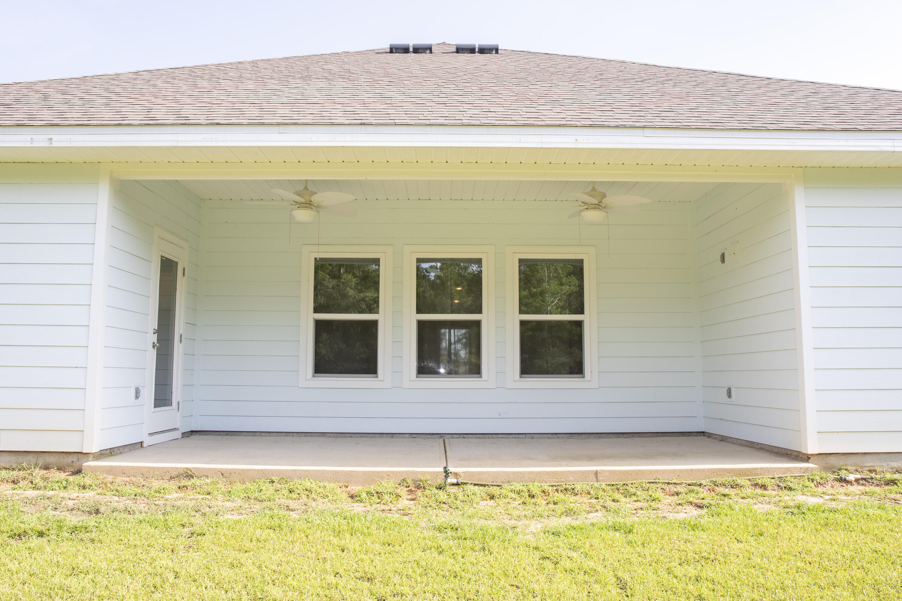 56 Secluded Circle Freeport, FL 32439 - Photo 24 of 26 a front view of a house with a swimming pool