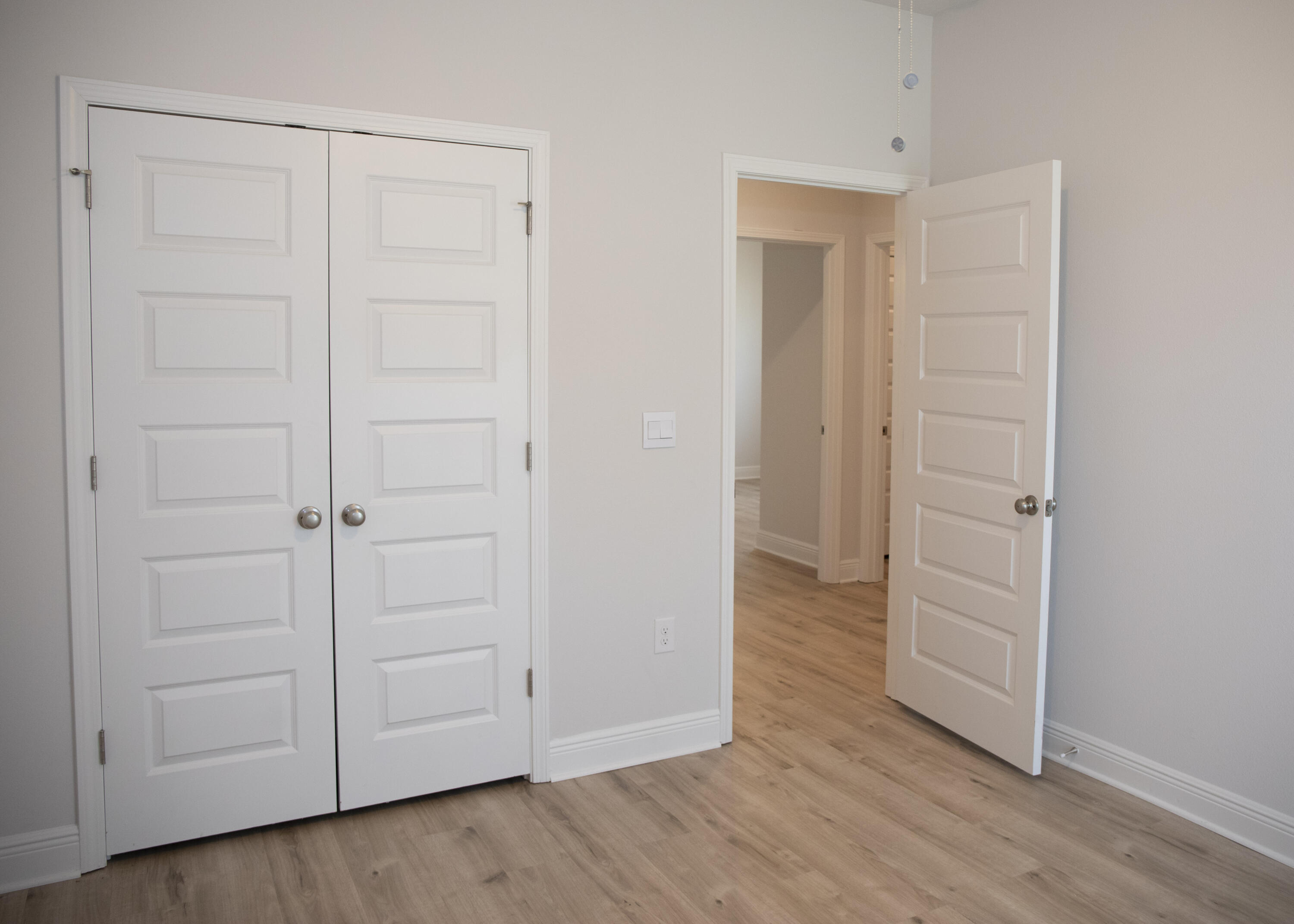 56 Secluded Circle Freeport, FL 32439 - Photo 8 of 26 an empty room with wooden floor