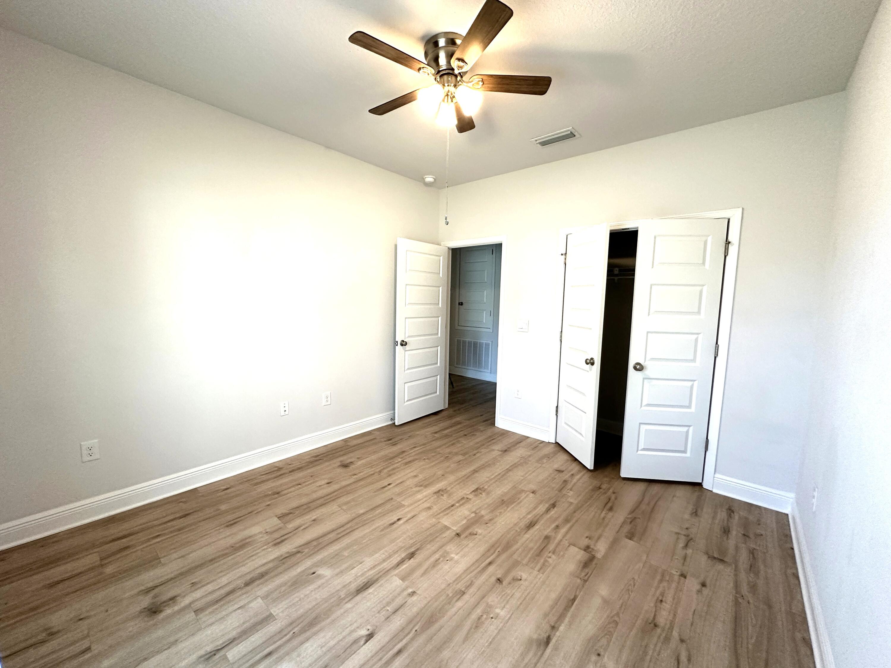 56 Secluded Circle Freeport, FL 32439 - Photo 10 of 26 wooden floor in an empty room