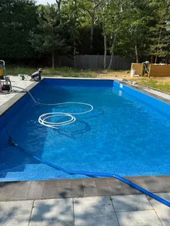 a view of swimming pool with seating space