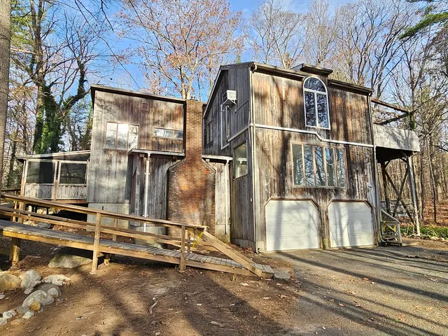a view of a house with a street