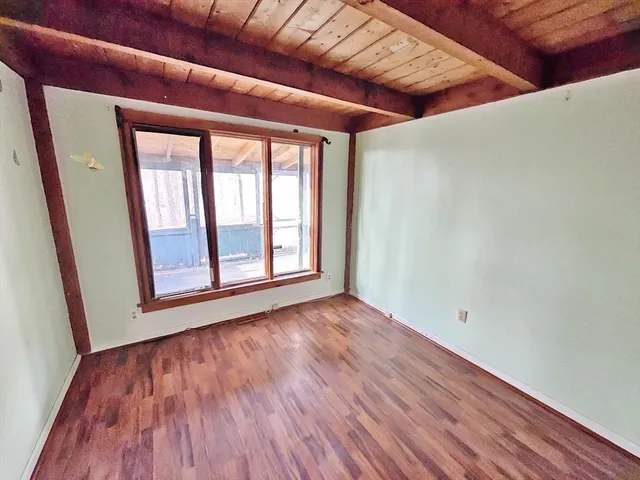 a view of a livingroom with wooden floor