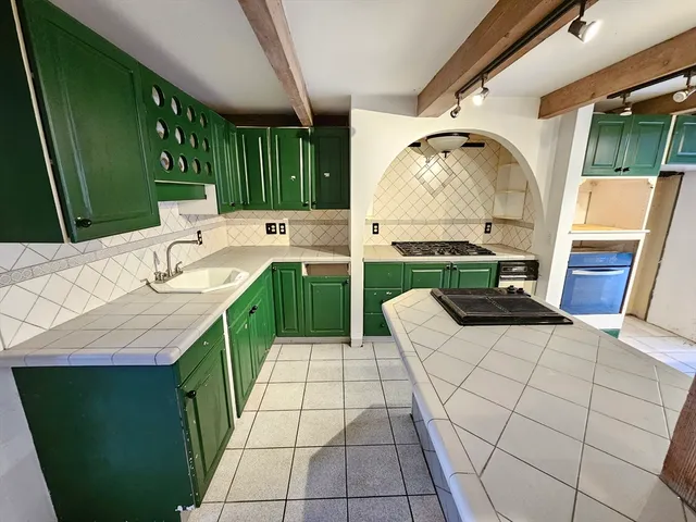 a bathroom with a sink and mirror