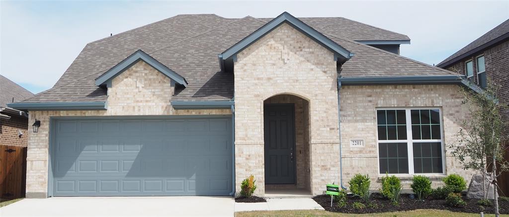 2201 Yellowhammer Road Denton, TX 76205 - Photo 2 of 36 a front view of a house with garden