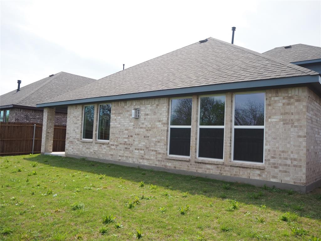 2201 Yellowhammer Road Denton, TX 76205 - Photo 35 of 36 a front view of a house with a garden