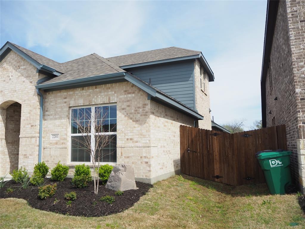 2201 Yellowhammer Road Denton, TX 76205 - Photo 4 of 36 a view of a house with wooden fence and potted plants