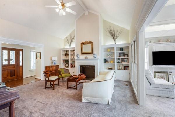 167 Edgewater Drive Temple, GA 30179 - Photo 14 of 37 a living room with furniture a fireplace and a flat screen tv