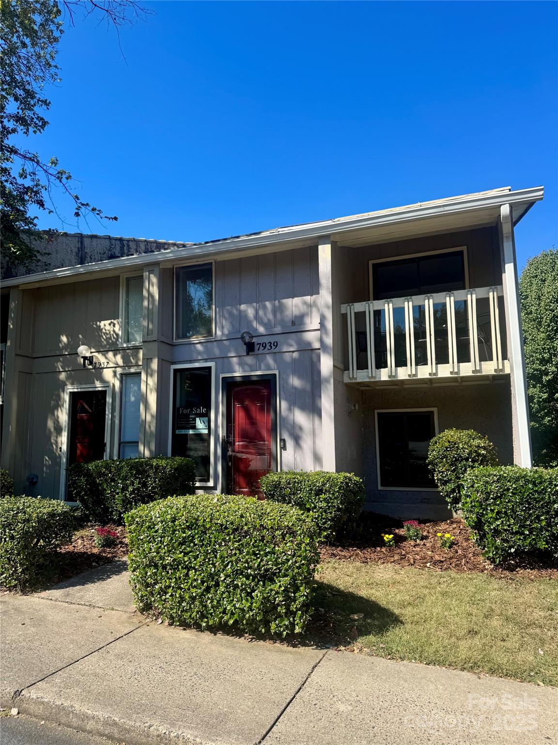 7939 Charter Oak Lane Charlotte, NC 28226 - Photo 1 of 28 a front view of a house with garden
