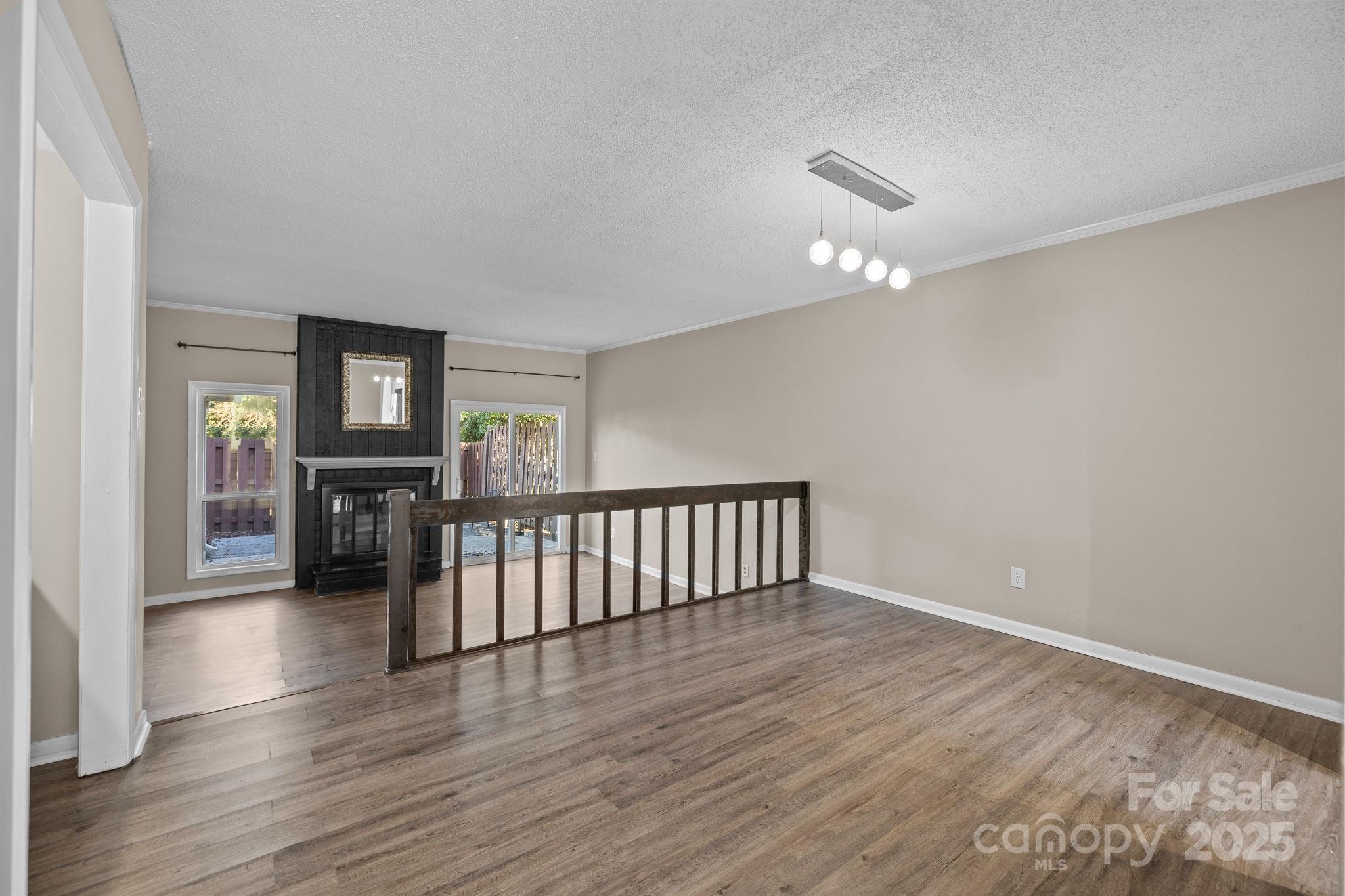 7939 Charter Oak Lane Charlotte, NC 28226 - Photo 13 of 28 a view of a livingroom with wooden floor