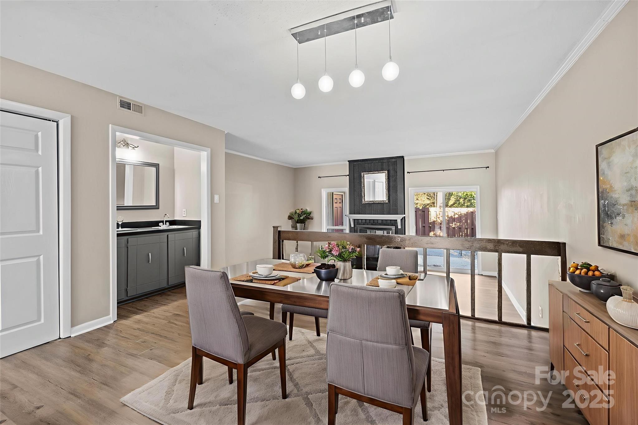 7939 Charter Oak Lane Charlotte, NC 28226 - Photo 7 of 28 a view of a dining room with furniture and wooden floor
