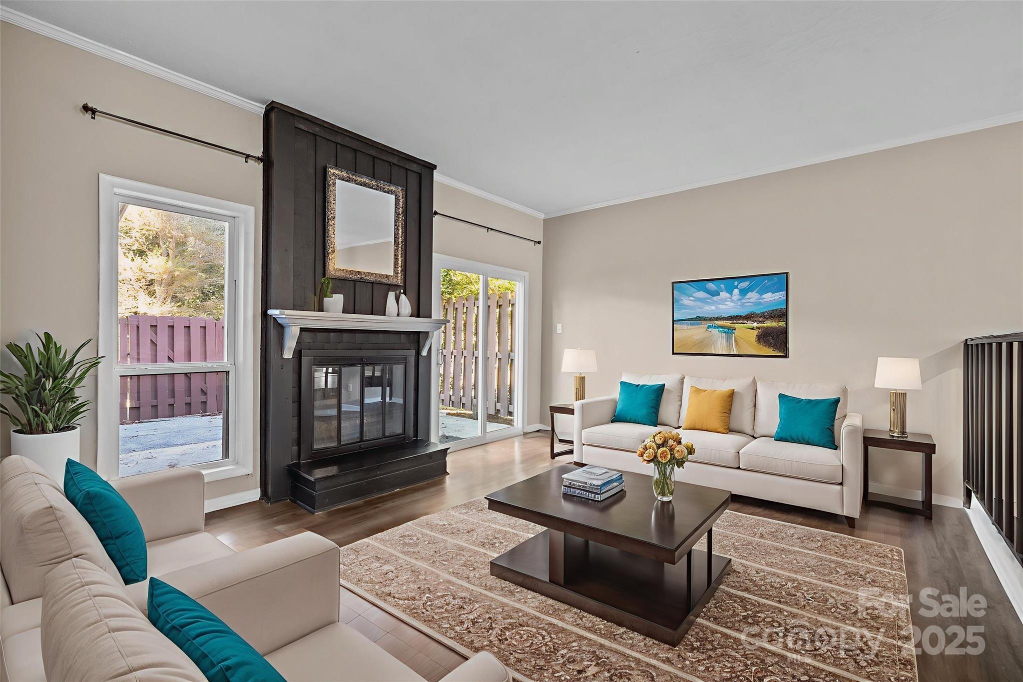 7939 Charter Oak Lane Charlotte, NC 28226 - Photo 10 of 28 a living room with furniture and a fireplace
