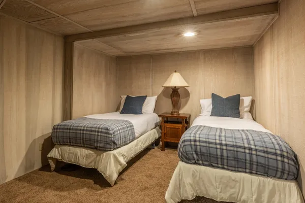 a bedroom with bed and a night stand