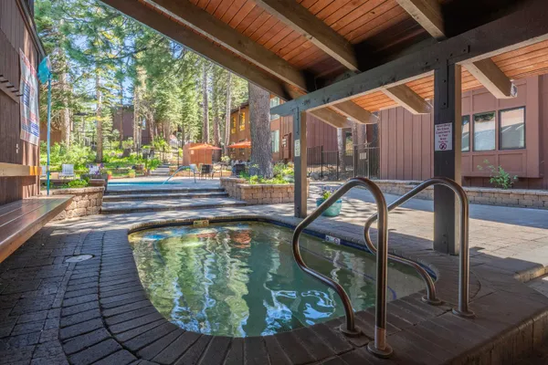 a swimming pool with outdoor seating