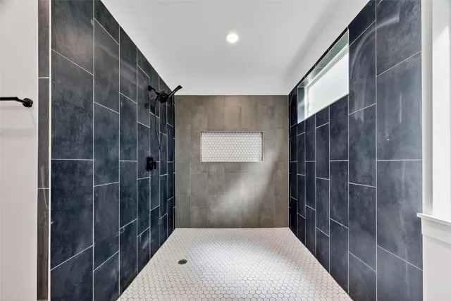 a bathroom with a shower and a sink
