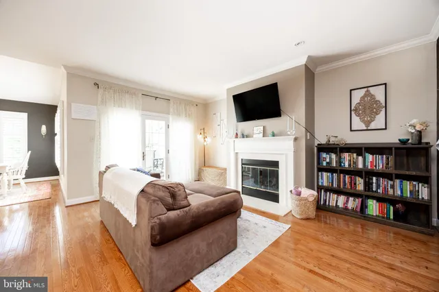 a living room with furniture fireplace and flat screen tv