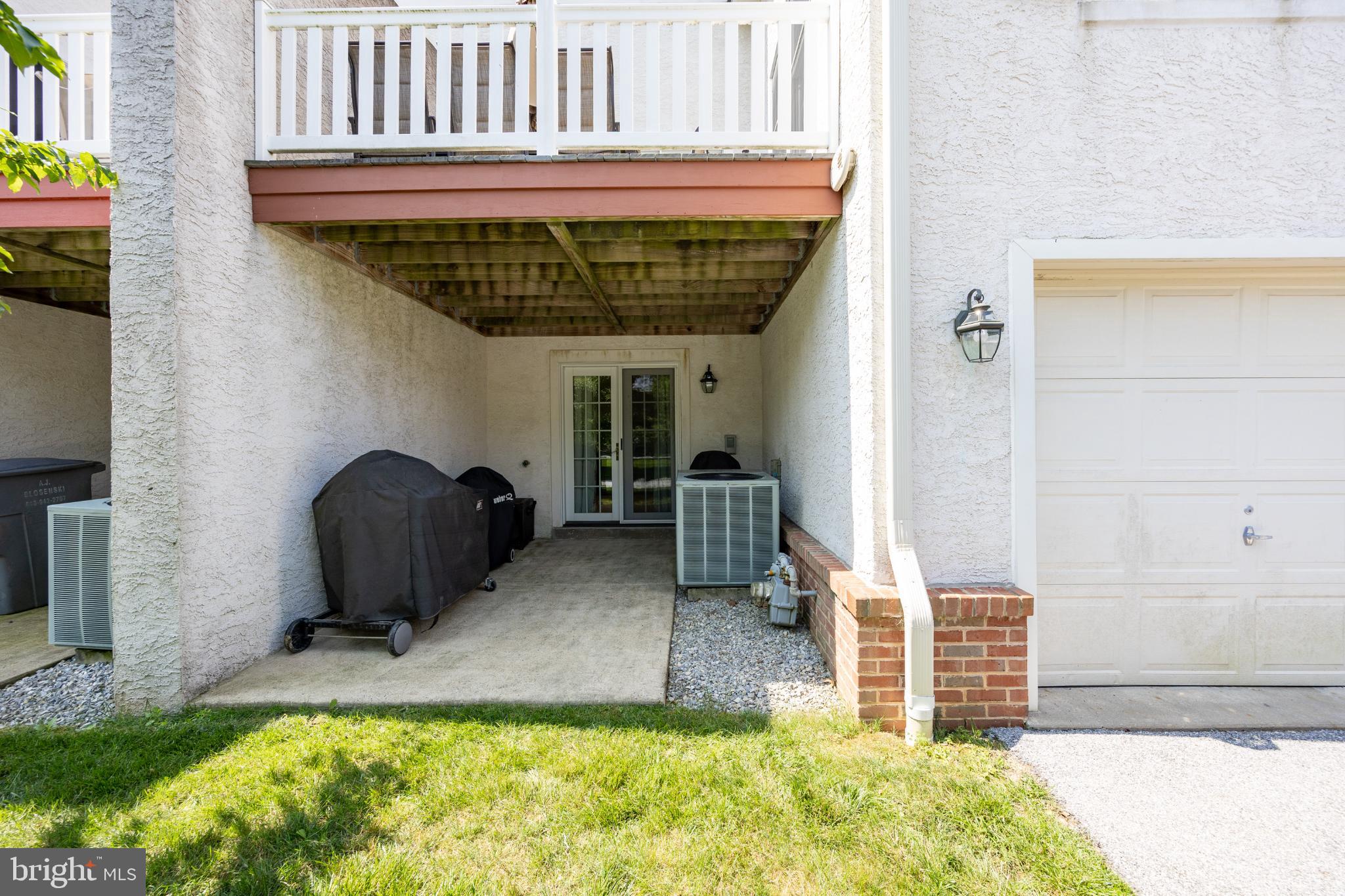 214 Windgate Drive Chester Springs, PA 19425 - Photo 19 of 45 a view of a porch with a table and chairs