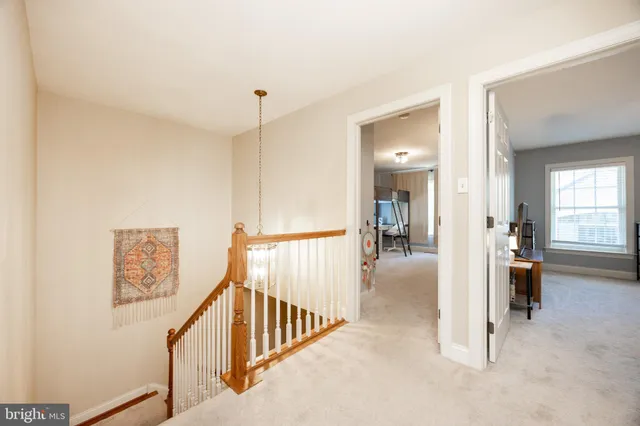 a view of a hallway view with staircase