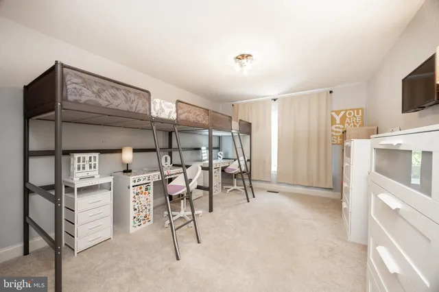 a view of a livingroom with furniture and a flat screen tv