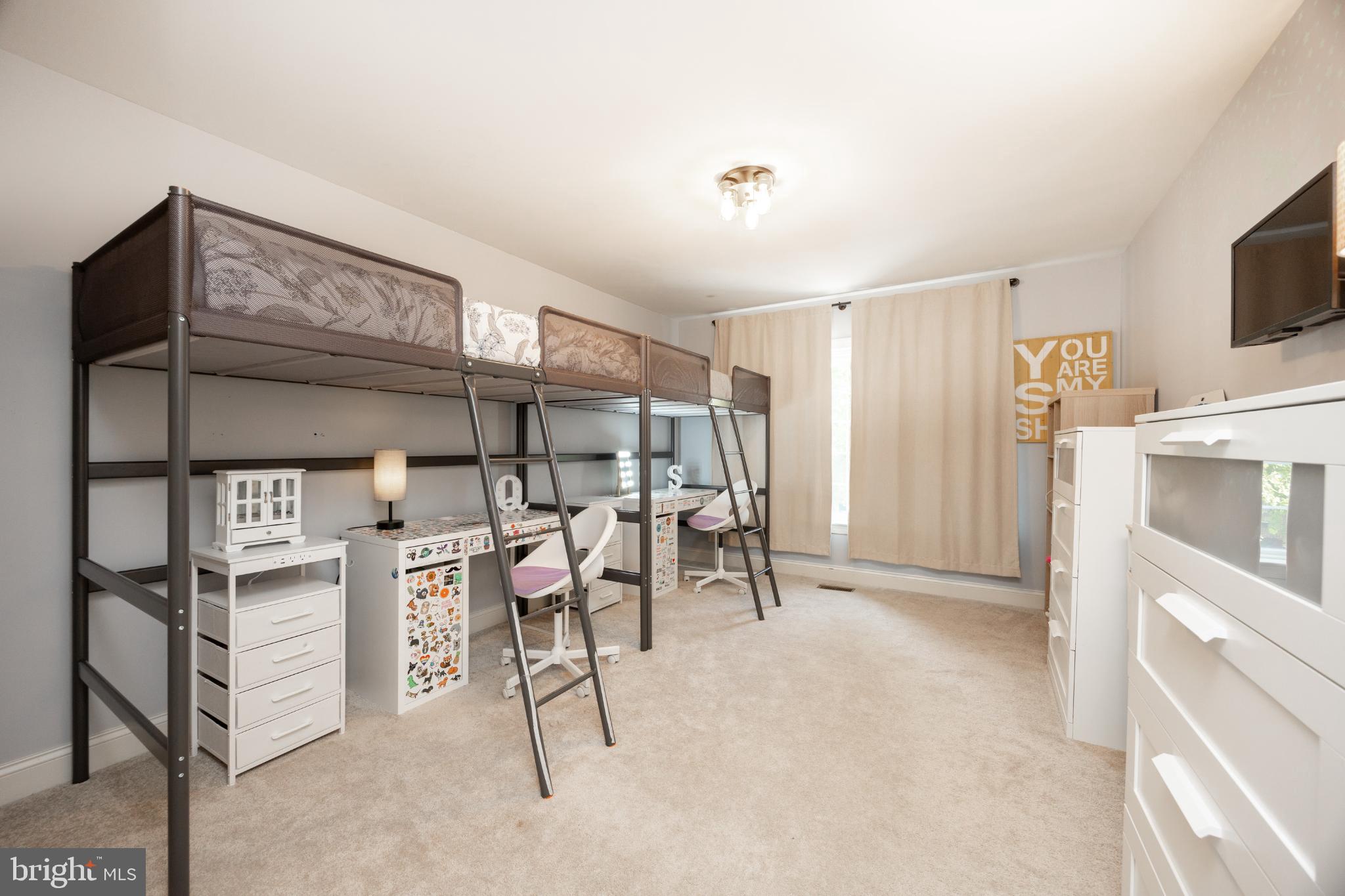 214 Windgate Drive Chester Springs, PA 19425 - Photo 30 of 45 a view of a livingroom with furniture and a flat screen tv