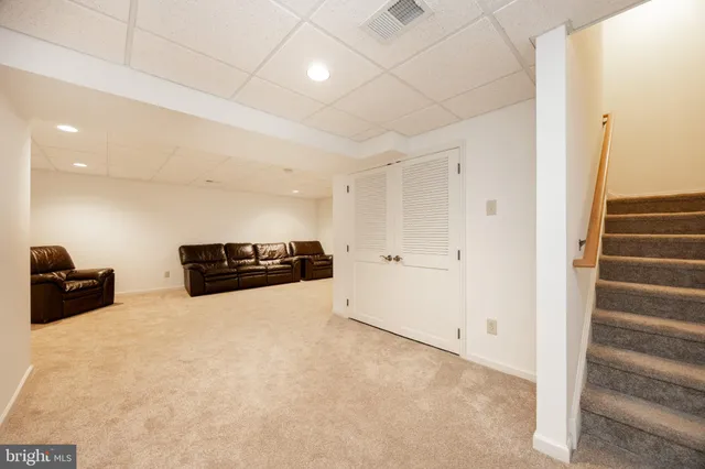 a view of a livingroom with a stove and a window